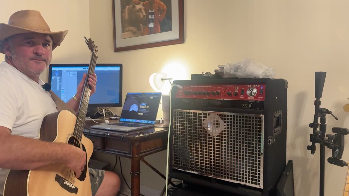 Andy with a Martin BC-16E acoustic bass next to the SWR Redhead combo